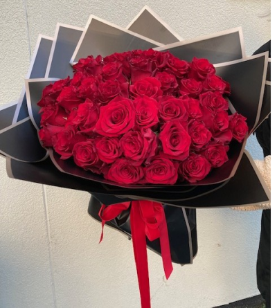 A Rose for a Rose - Selection of first grade compact roses wrapped to show off their beauty.